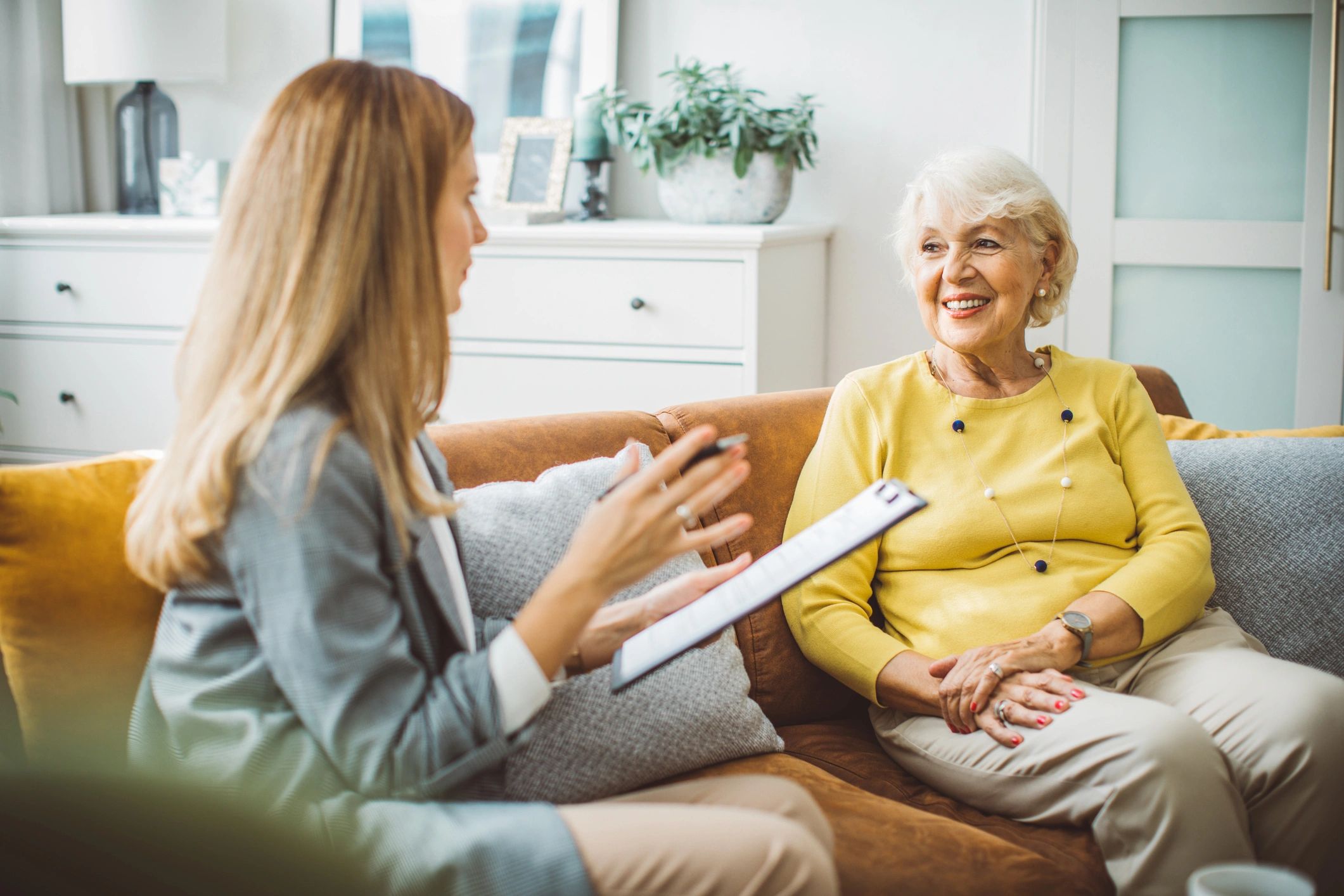 happy elderly client at home with caregiver